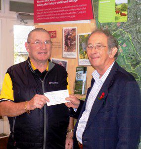 Mr Sandford receiving his cheque from TCCT chairman Alan Tyerman.