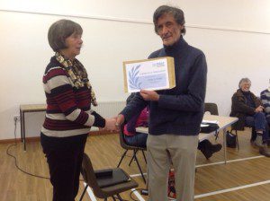 Cllr Gay Hill presents the certificate to Tony Colwill