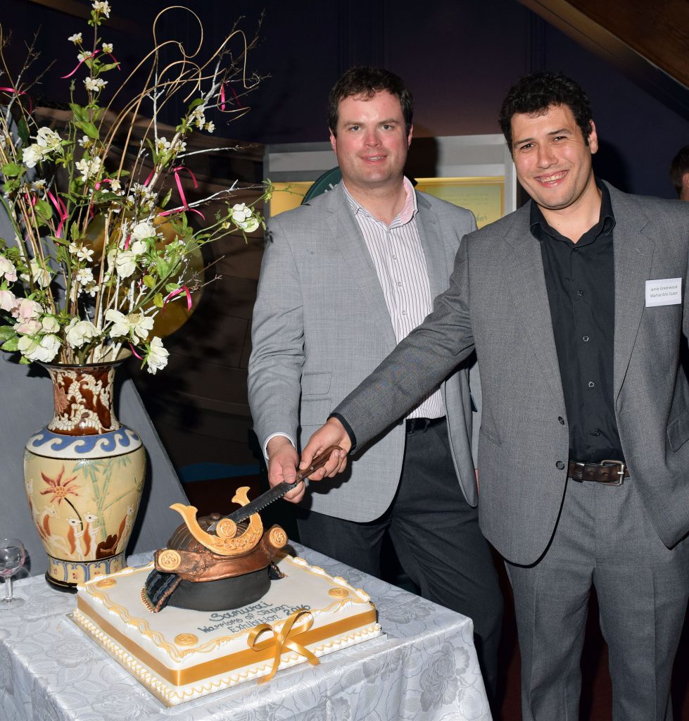 Kevin Foster MP and Martial Artists Expert Jamie Greenwood Cutting Samurai Cake