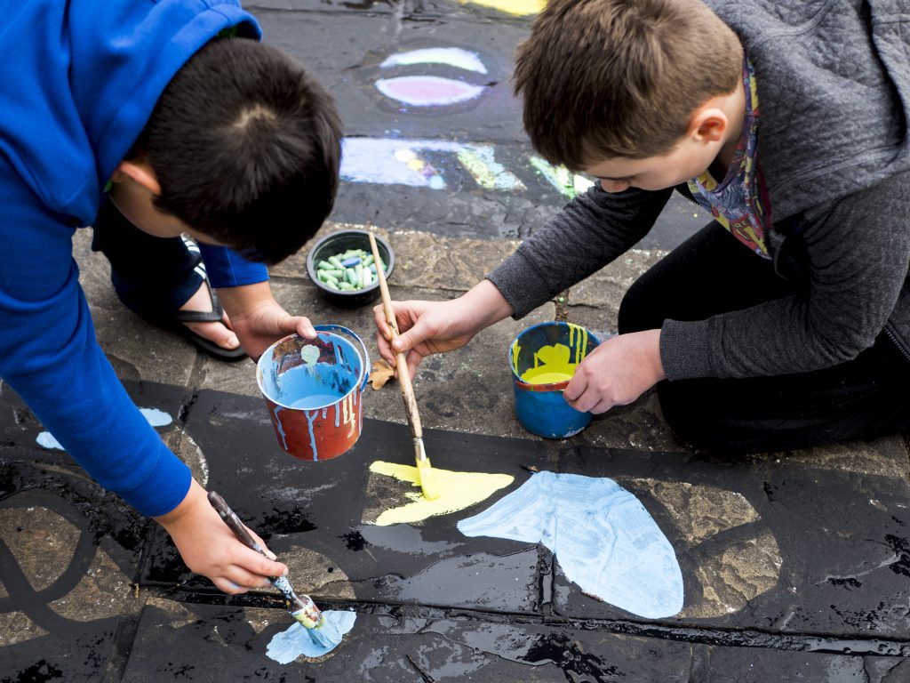 Children creating the Urban Canvas mural outside the town hall. Photo Credit Ryan Hardman